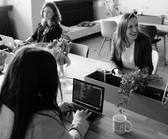 three women working at desk